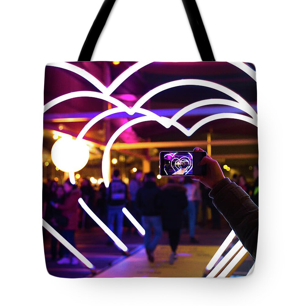Cool Attitude Tote Bag featuring the photograph Woman With Smartphone Taking Picture Of by Artur Debat
