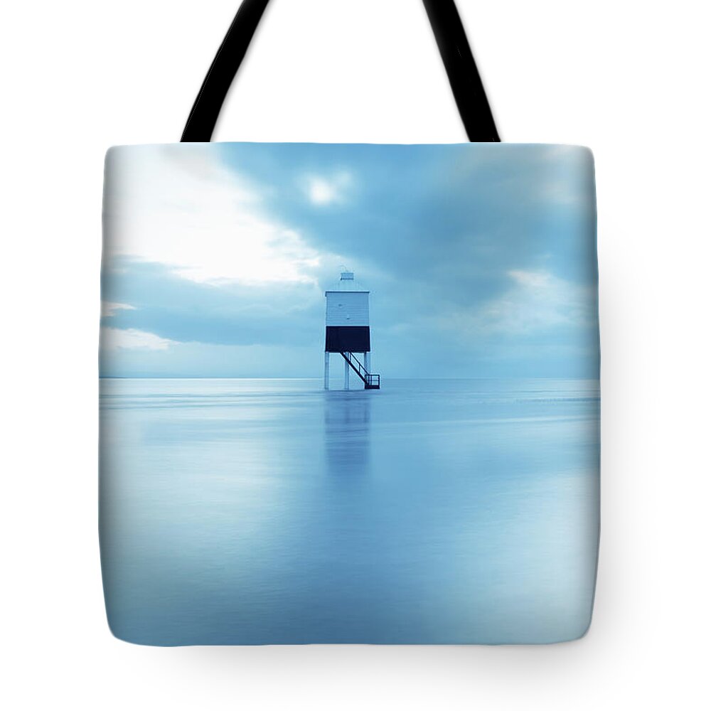 Tranquility Tote Bag featuring the photograph Wooden Lighthouse In The Sea At Dusk by James Osmond