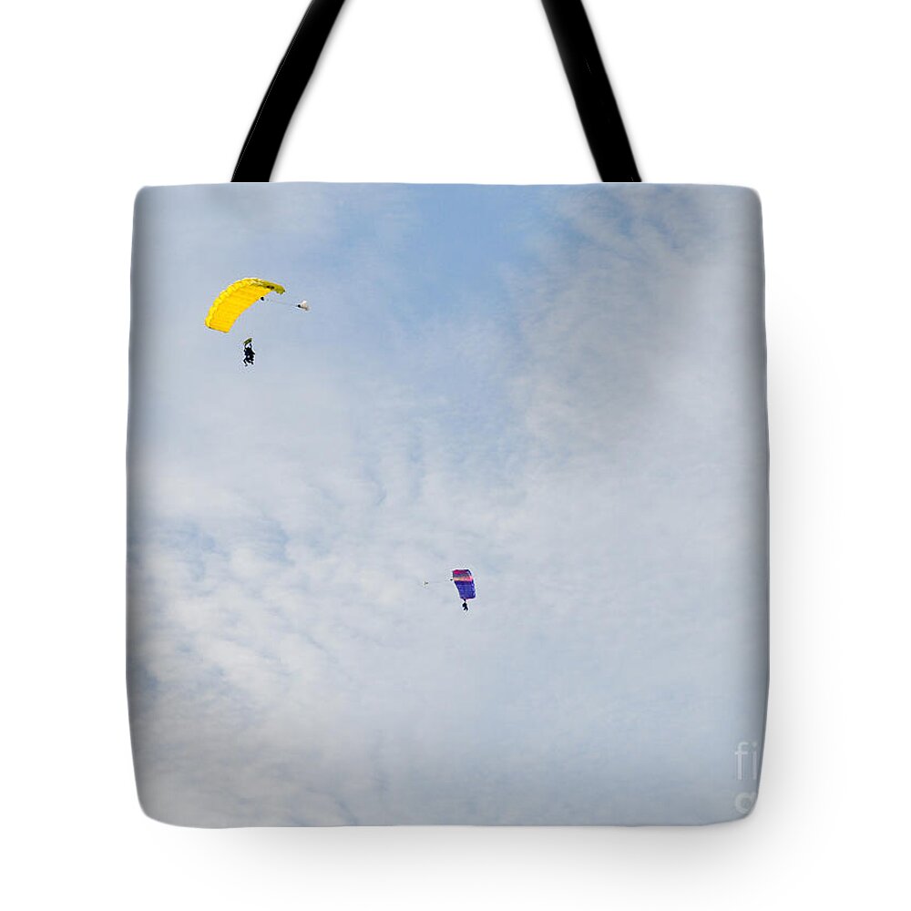 Skydiving Tote Bag featuring the photograph Yellow and Blue Mix Up by Cheryl McClure