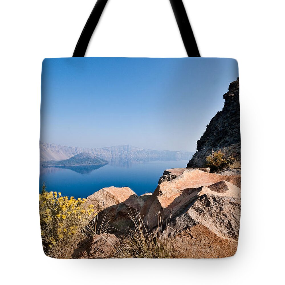 Awe Tote Bag featuring the photograph Yellow Wildflowers and Rocks Above Crater Lake by Jeff Goulden