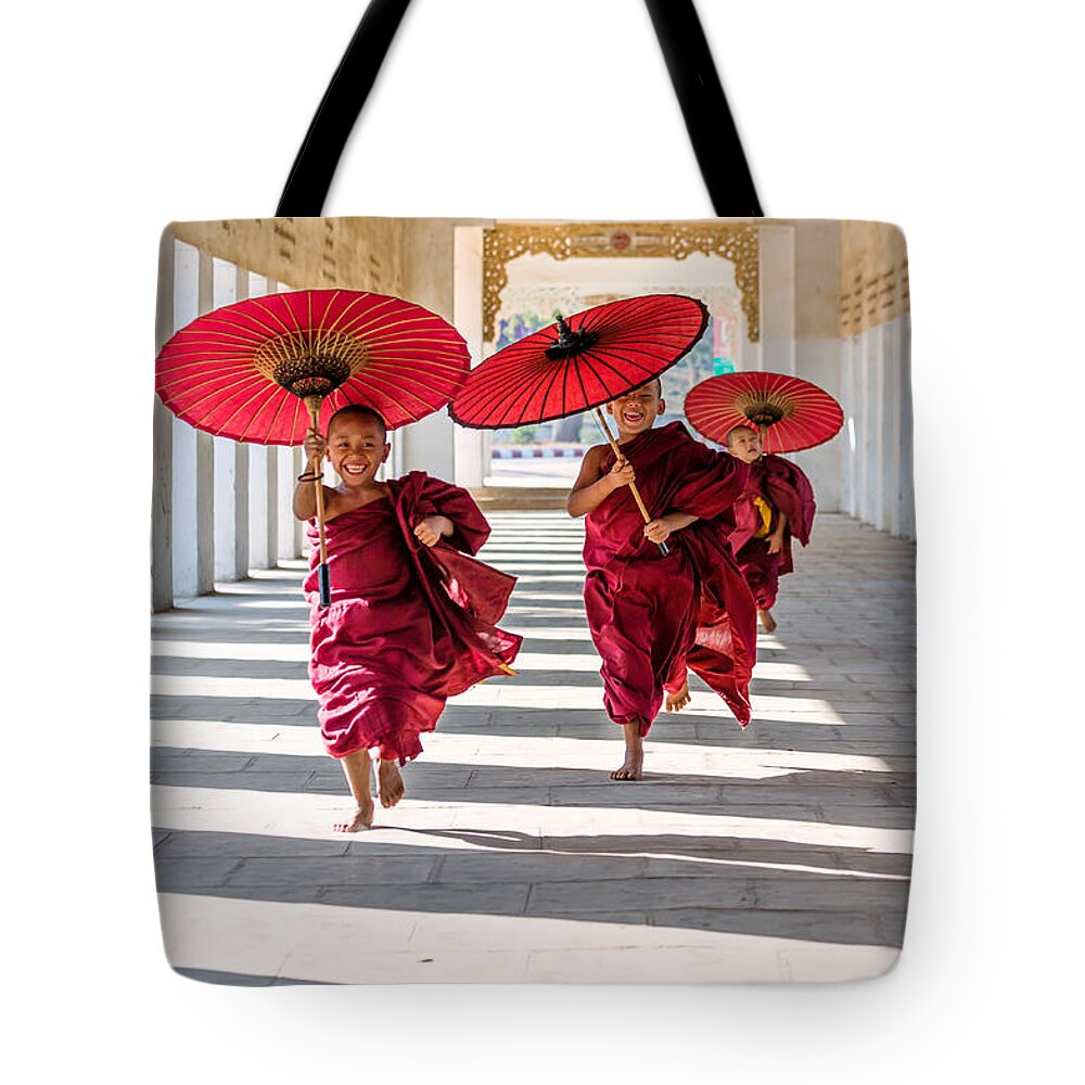 Children Tote Bag featuring the photograph Young buddhist monks on the run - Myanmar by Matteo Colombo