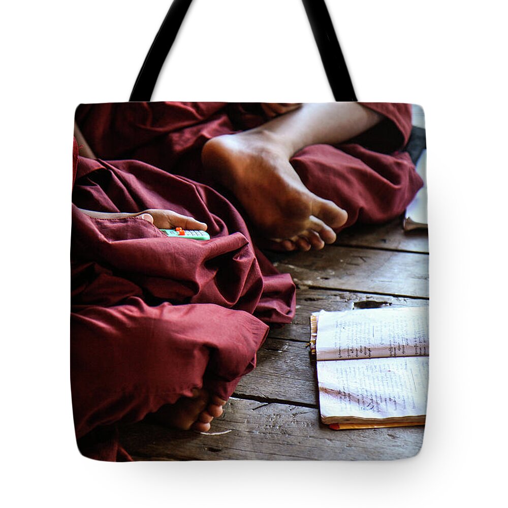 Hiding Tote Bag featuring the photograph Young Monk Playing With A Toy by Gary Koh, Singapore