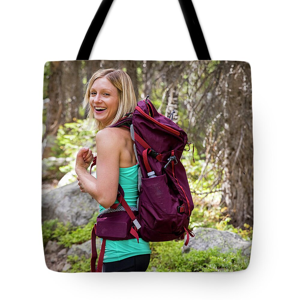 Exploration Tote Bag featuring the photograph Young Woman Hiking In The Colorado by Alexandra Simone