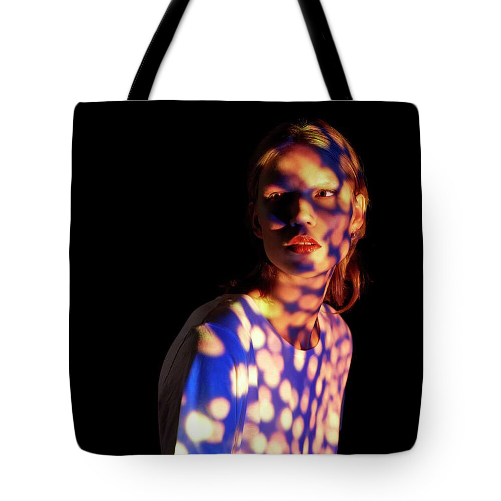 People Tote Bag featuring the photograph Young Woman With Interesting Lighting by Mads Perch