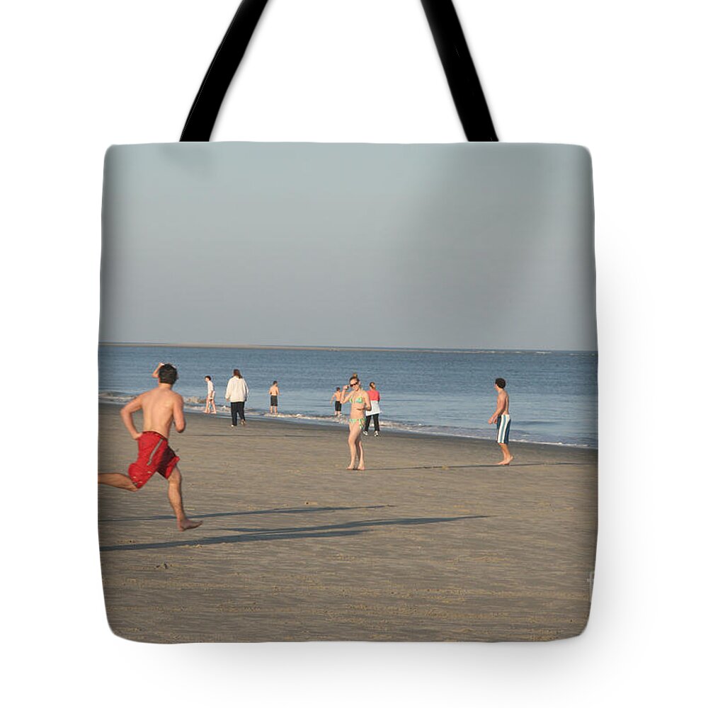 Barony Beach Club Tote Bag featuring the photograph Youth Playing on the Beach at Hilton Head South Carolina by Thomas Marchessault