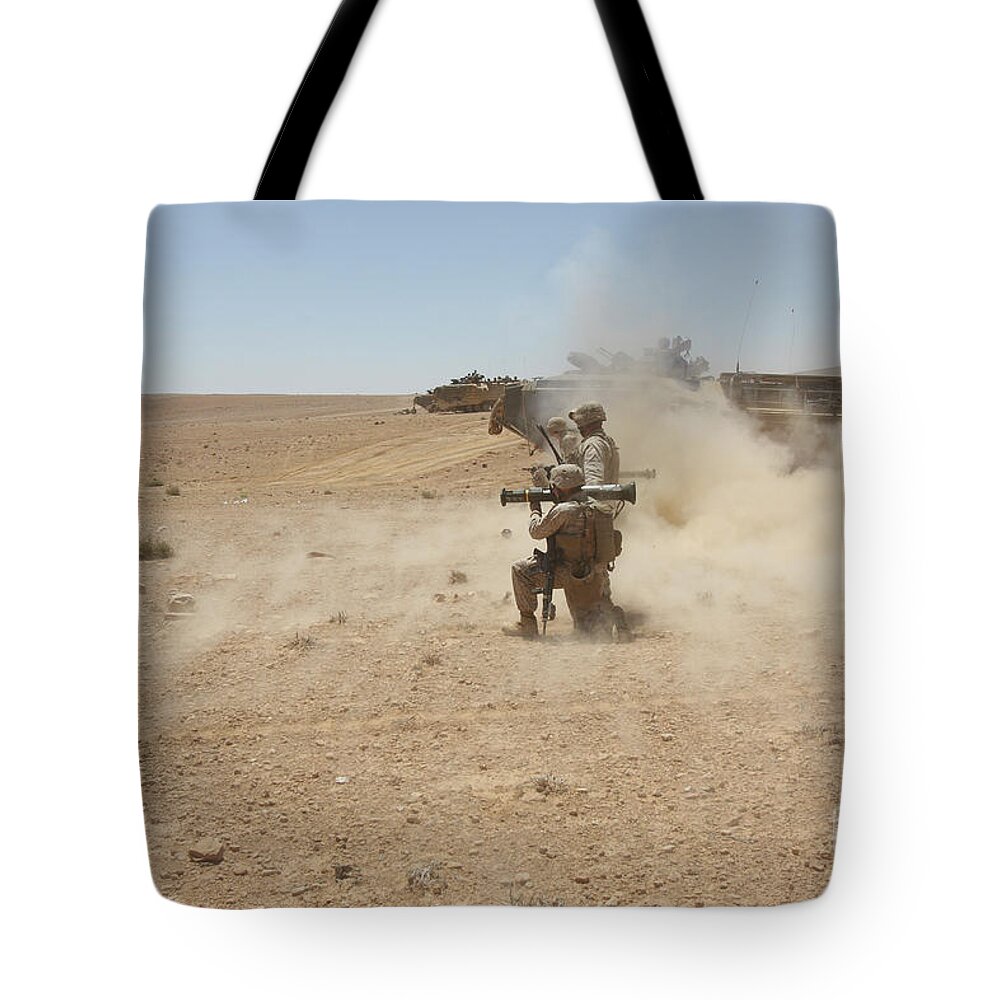 Us Marine Corps Tote Bag featuring the photograph U.s. Marines Fire Several #1 by Stocktrek Images