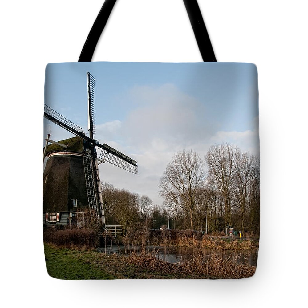 Amsterdam Tote Bag featuring the digital art Windmill in Amsterdam #1 by Carol Ailles