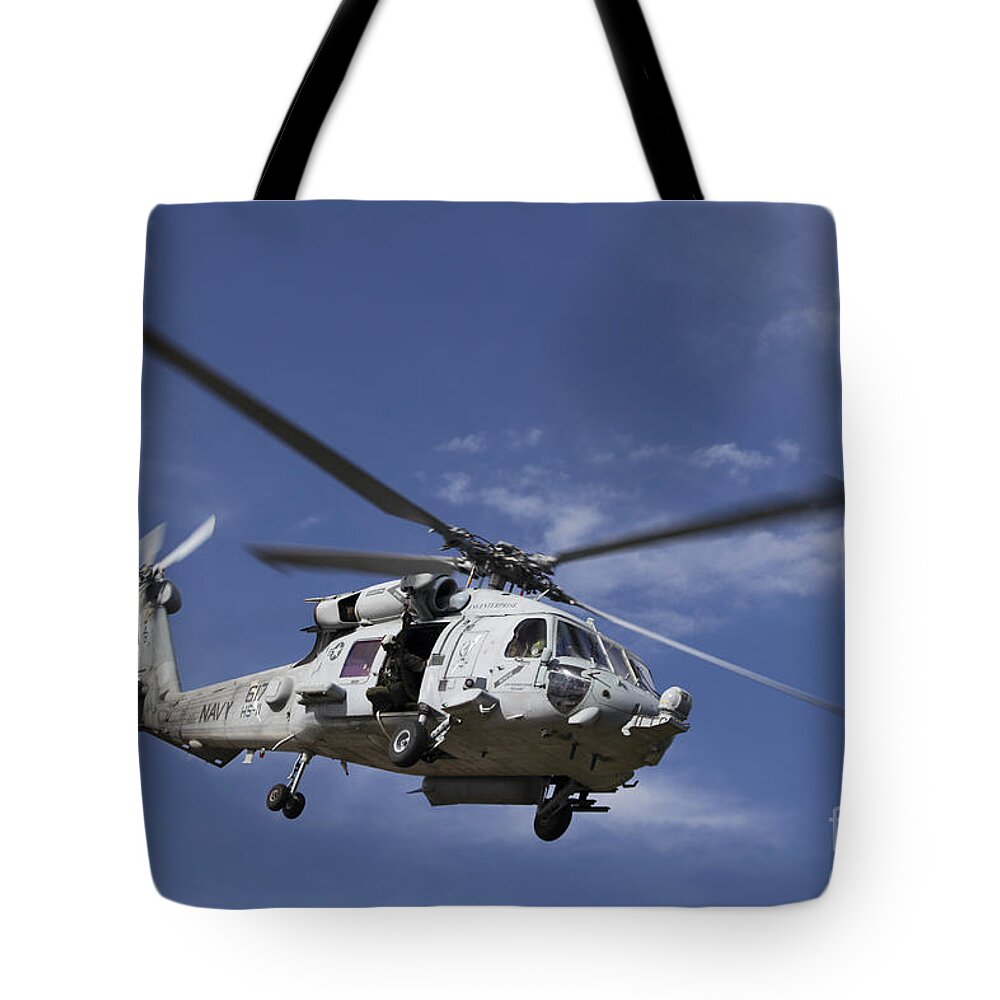 Military Tote Bag featuring the photograph A Crew Chief Looks Out The Side Door by Michael Wood