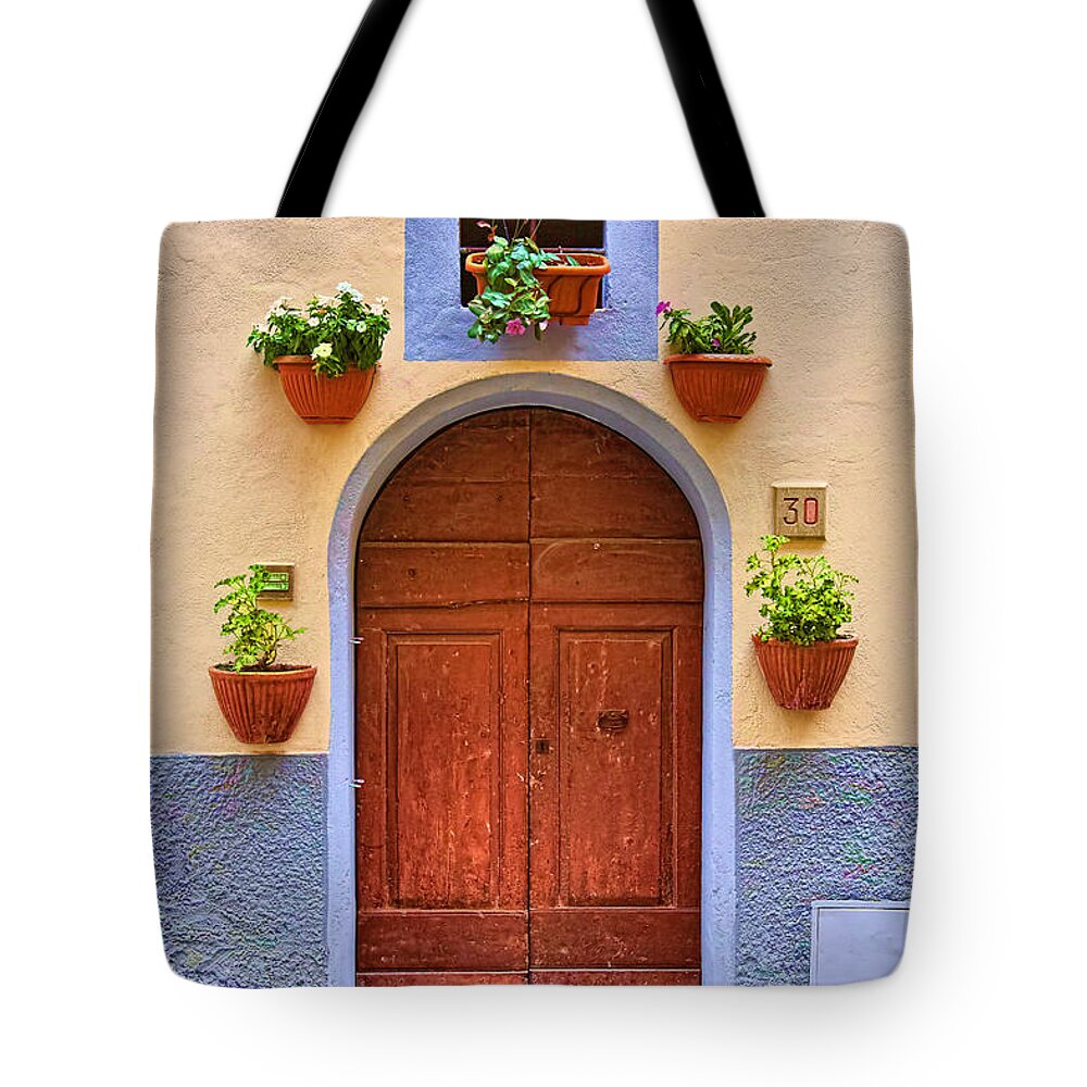 Colorful Tote Bag featuring the photograph A door in Monte Carlo Italy by Fred J Lord