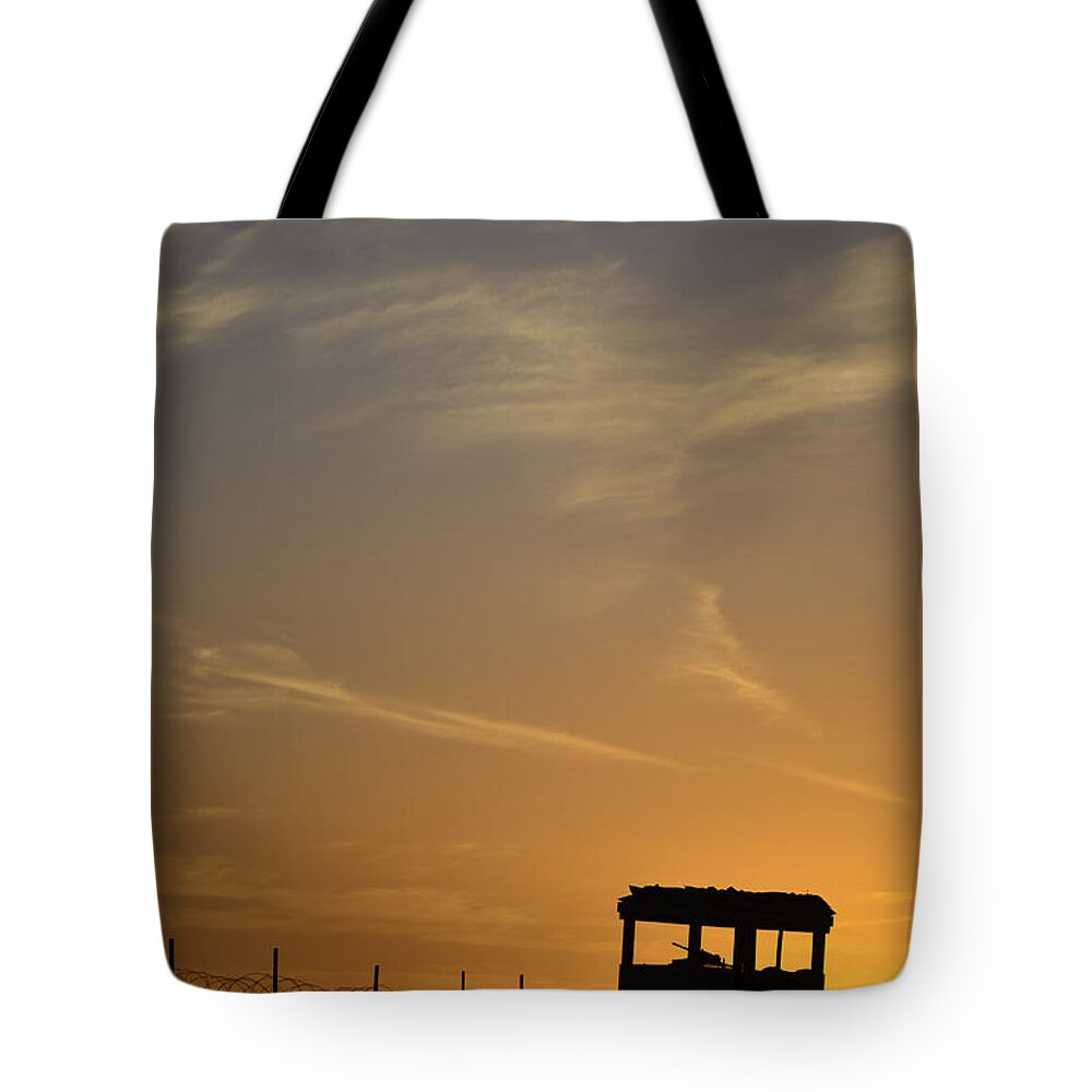 Afghanistan Tote Bag featuring the photograph A Remote Combat Outpost On The Eastern by Stocktrek Images