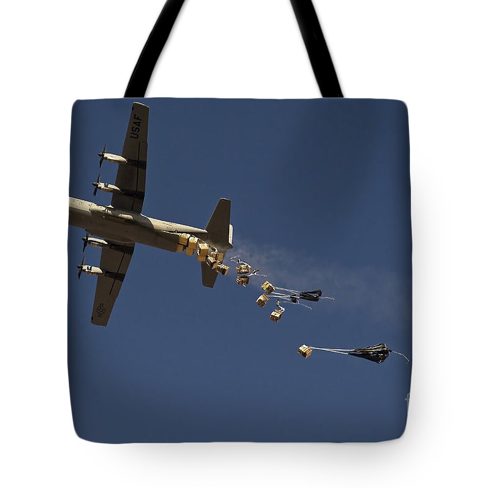 Large Group Of Objects Tote Bag featuring the photograph A U. S. Air Force C-130 Hercules by Stocktrek Images