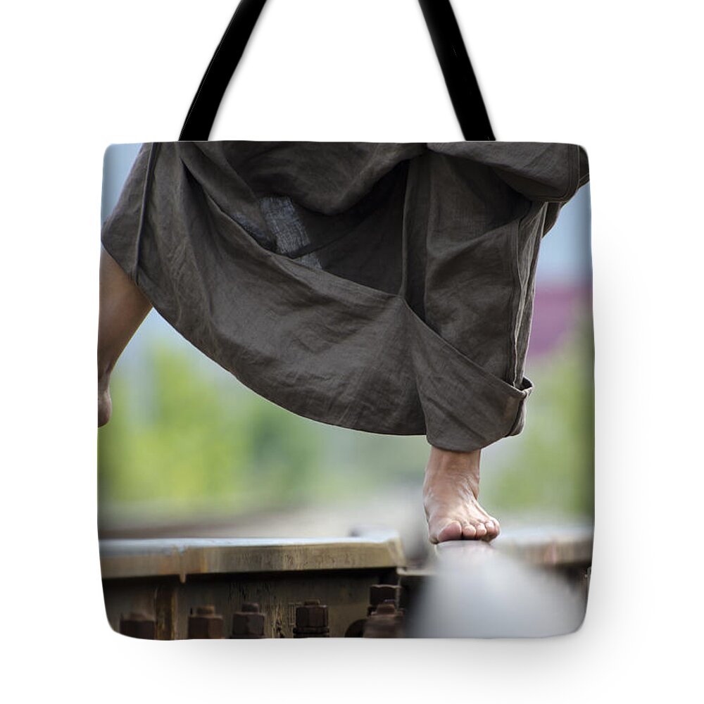 Shoes Tote Bag featuring the photograph Balance on railroad tracks by Mats Silvan