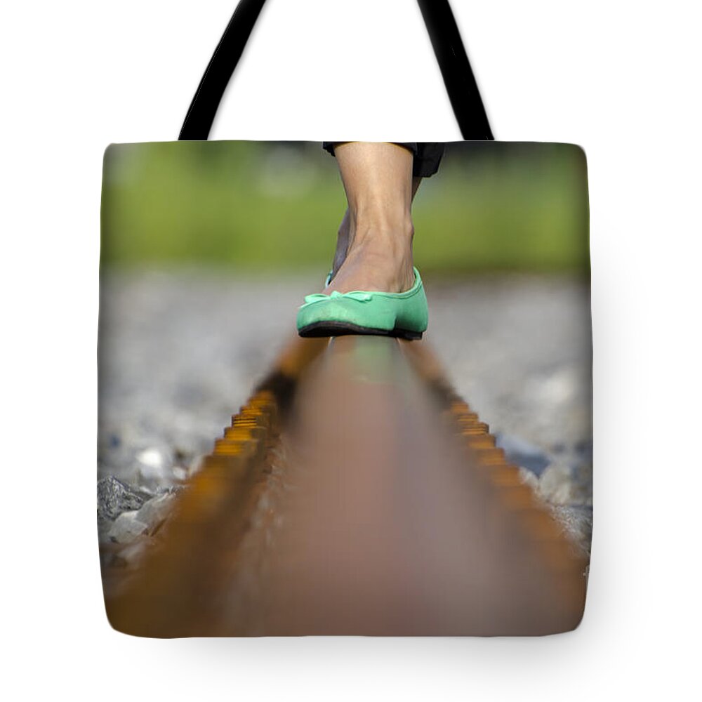 Shoes Tote Bag featuring the photograph Balance with her feet by Mats Silvan