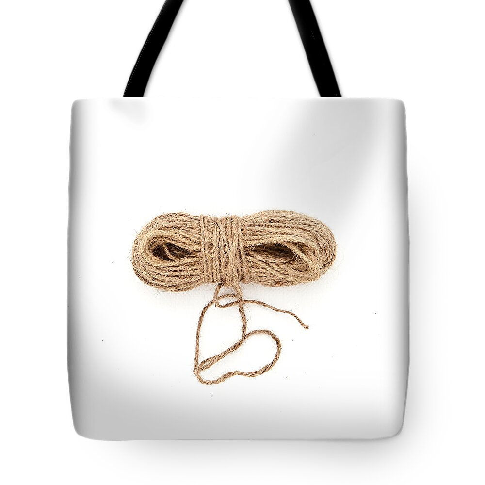 Background Tote Bag featuring the photograph Ball of string by Tom Gowanlock