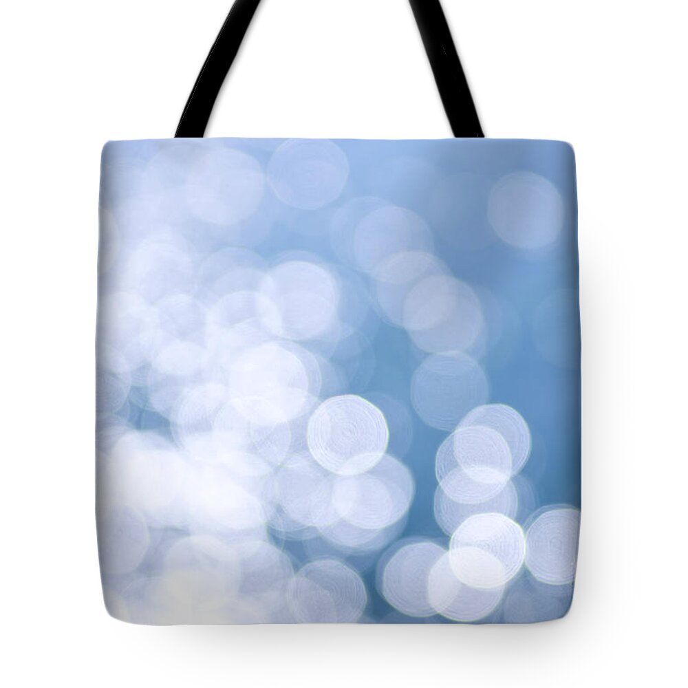 Blue Tote Bag featuring the photograph Blue water and sunshine abstract by Elena Elisseeva
