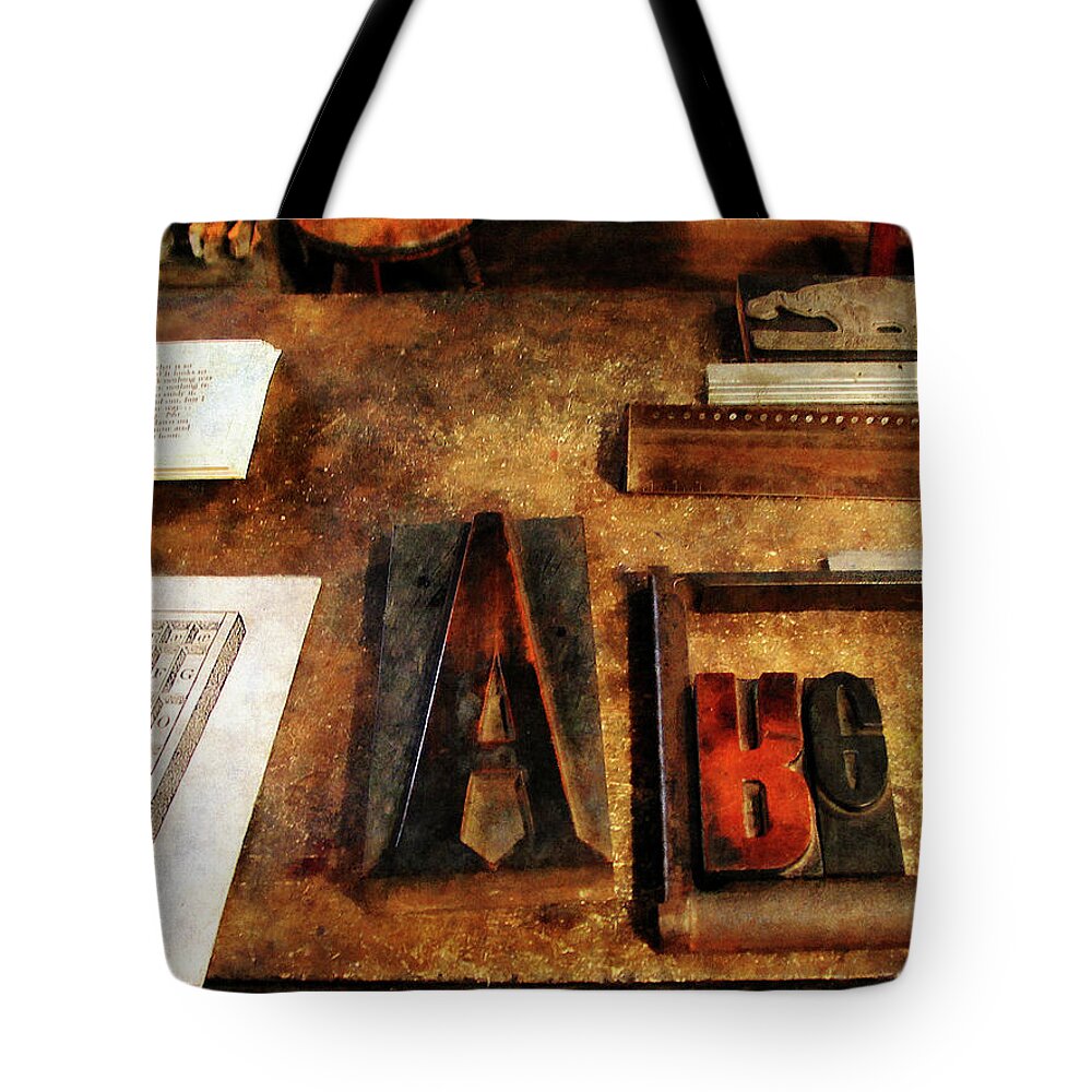 A Tote Bag featuring the photograph Capital A by Susan Savad