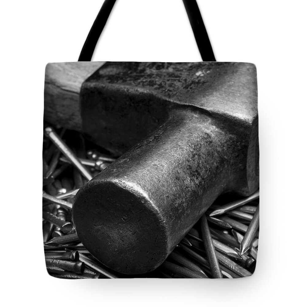 Clare Bambers Tote Bag featuring the photograph Carpenter Handyman Hammer and Nails by Clare Bambers