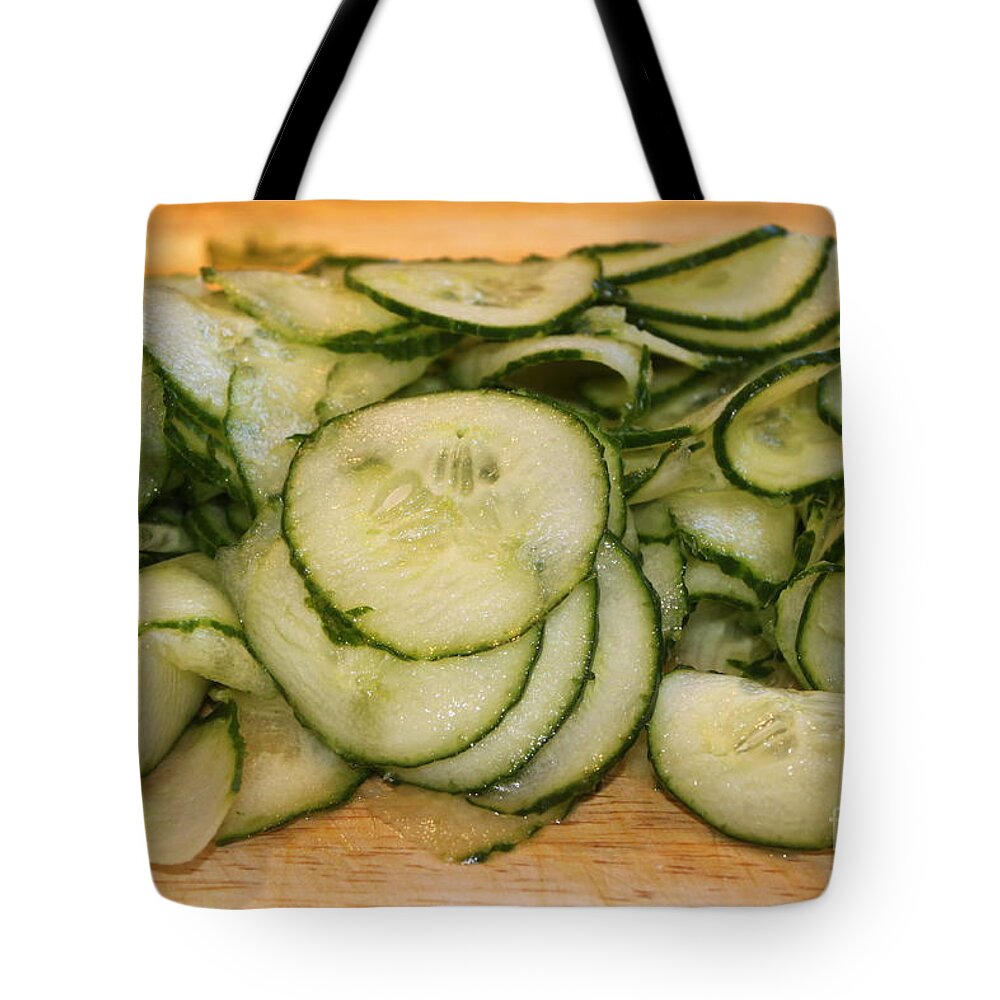 Meal Tote Bag featuring the photograph Cucumbers by Henrik Lehnerer
