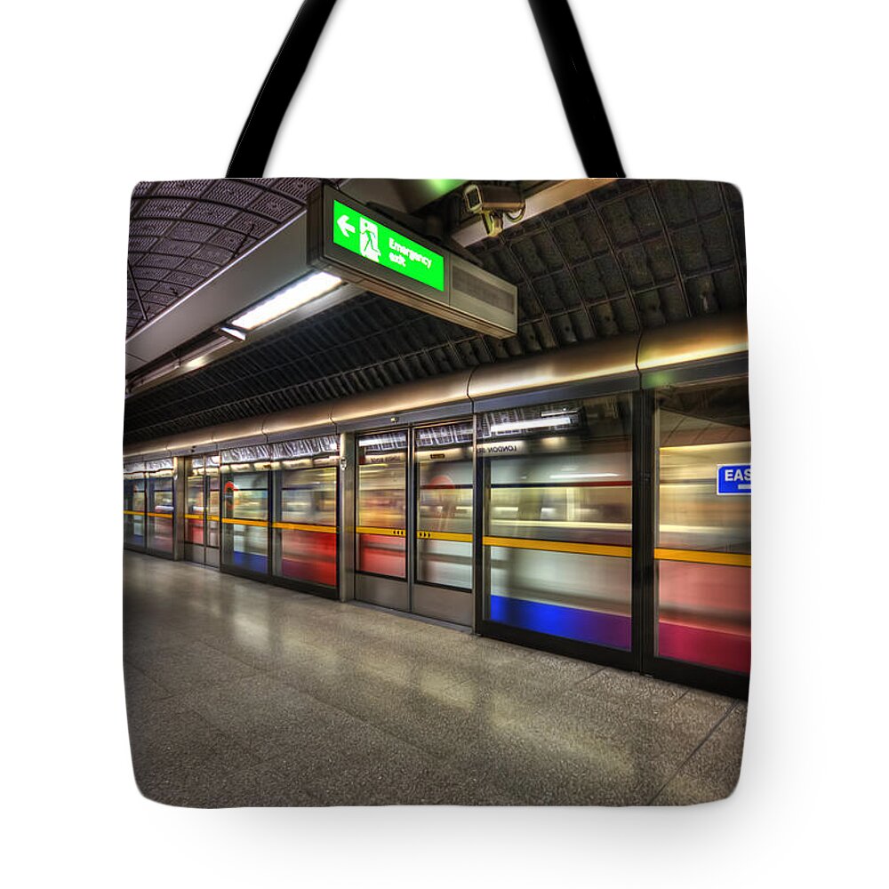 Underground Tote Bag featuring the photograph Eastbound by Evelina Kremsdorf