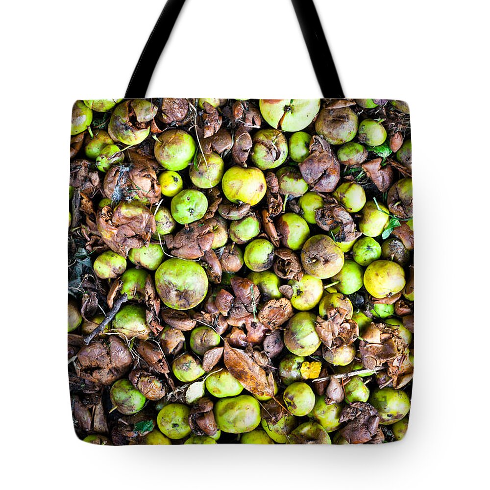 Agricultural Tote Bag featuring the photograph Fallen apples by Tom Gowanlock
