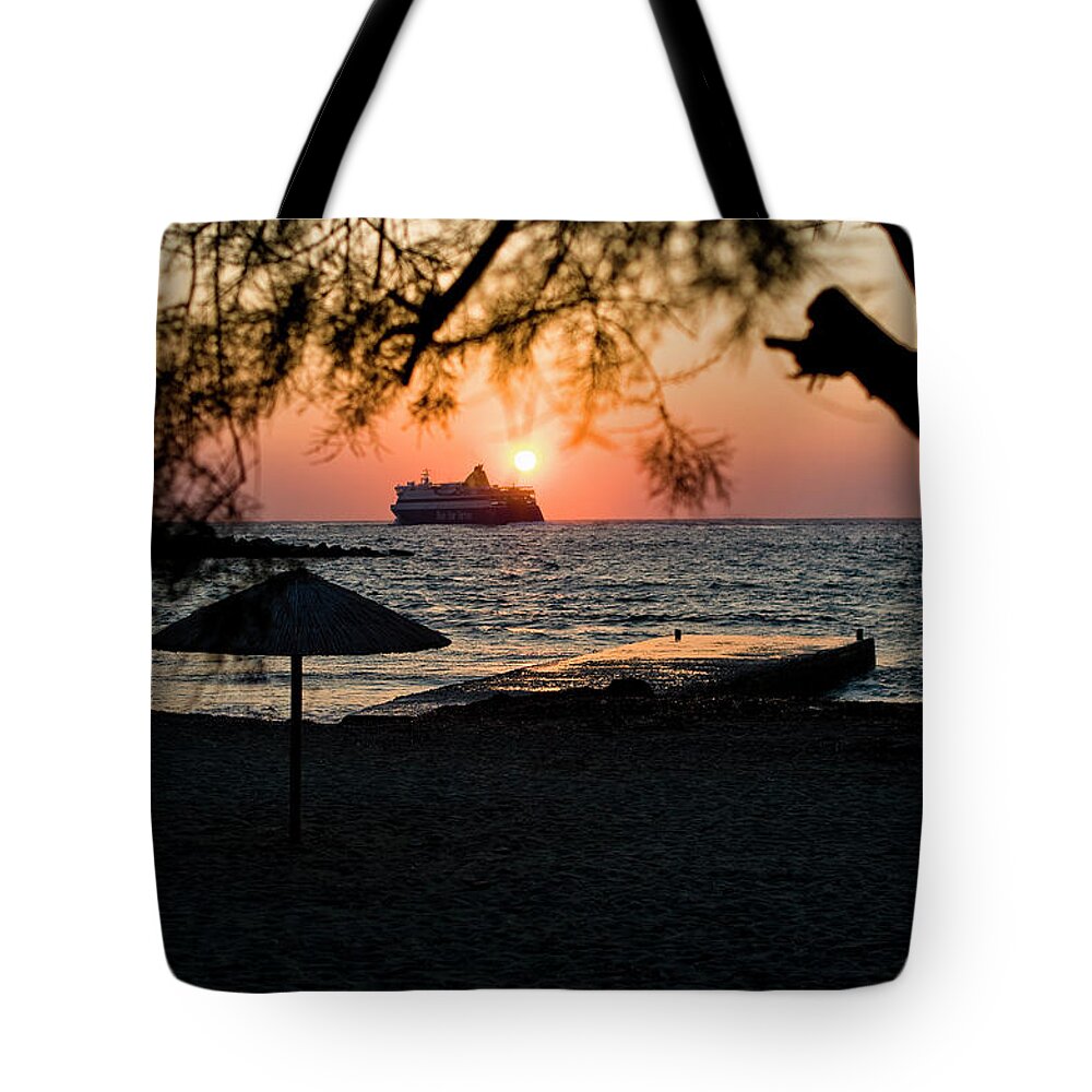 Paros Island Greece Tote Bag featuring the photograph Ferry Meets Setting Sun by Lorraine Devon Wilke