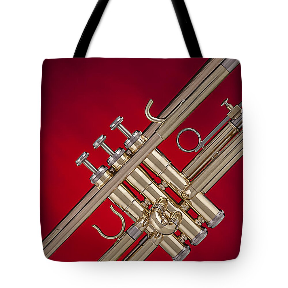 Trumpet Tote Bag featuring the photograph Gold Trumpet Isolated On Red by M K Miller