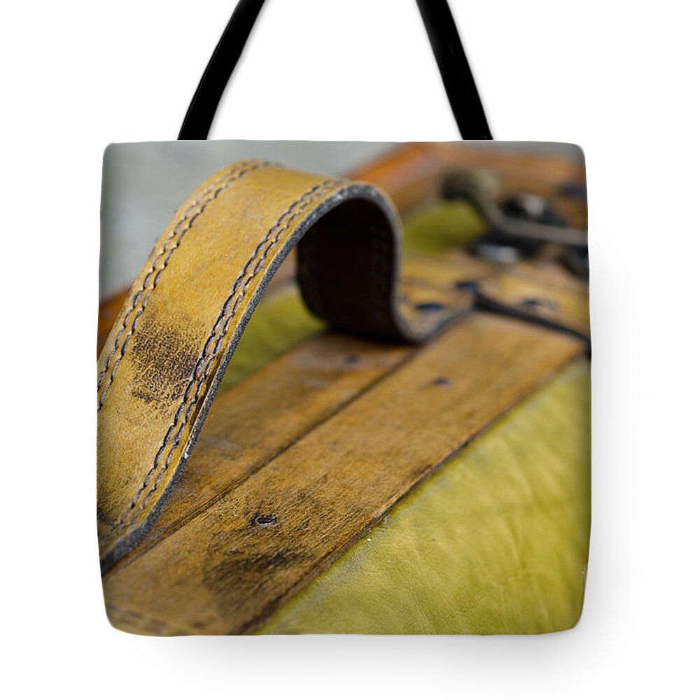 Handle Tote Bag featuring the photograph Handle on a suitcase by Mats Silvan