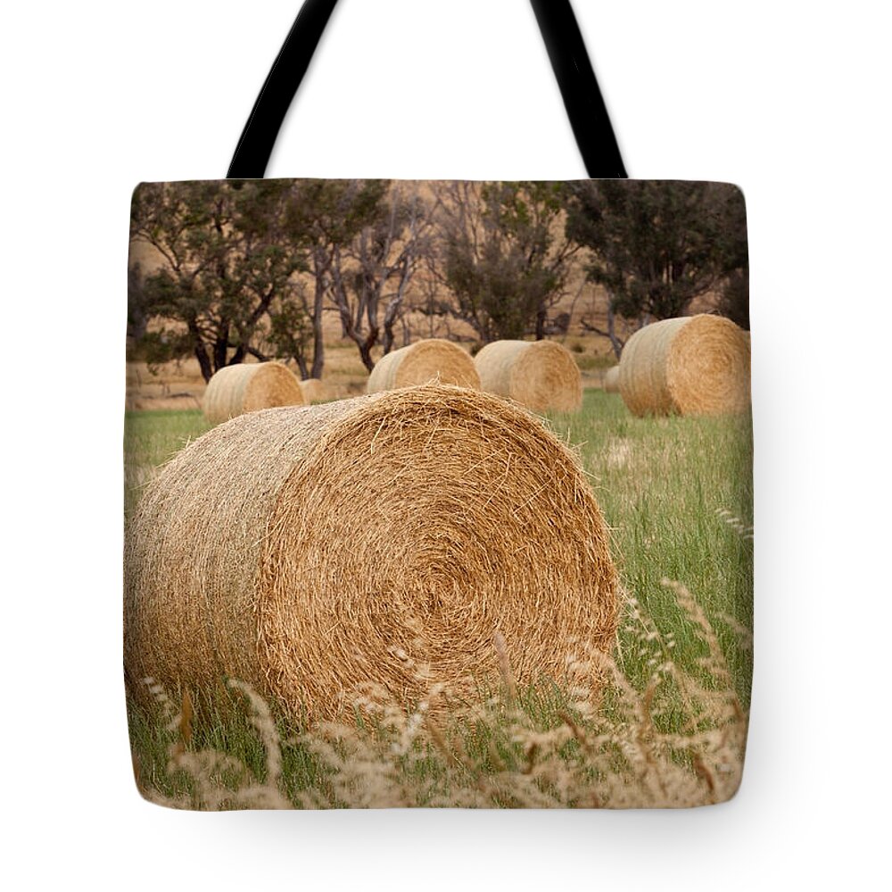 Rural Tote Bag featuring the photograph Hay Bales by Michelle Wrighton