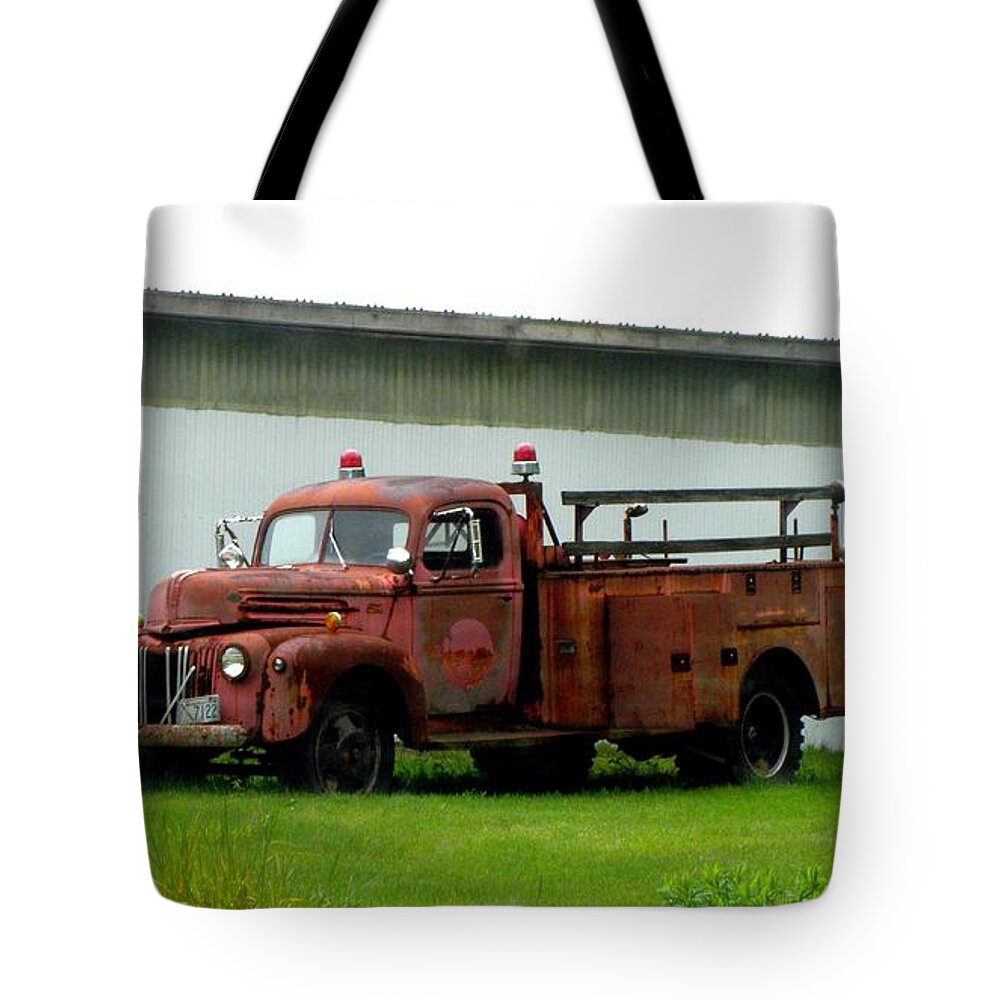 Firetruck Tote Bag featuring the photograph I used to put it out by Kim Galluzzo