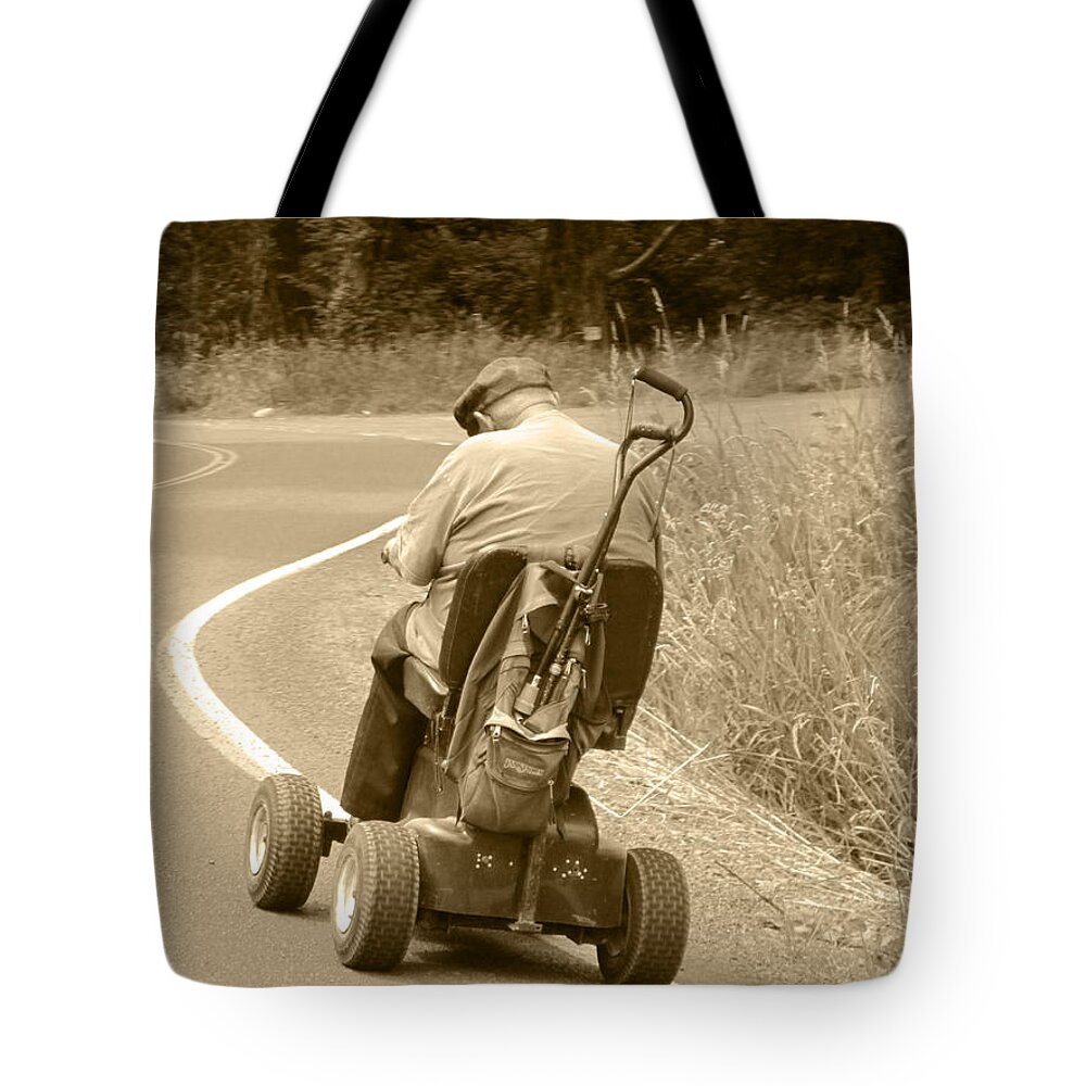 Old Man On Scooter Tote Bag featuring the photograph I'll Get There by Kym Backland