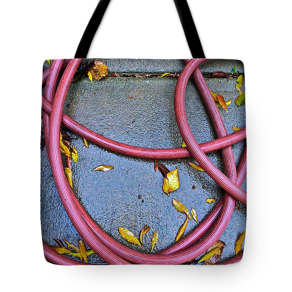Leaves Tote Bag featuring the photograph Leaves And Hose by Bill Owen