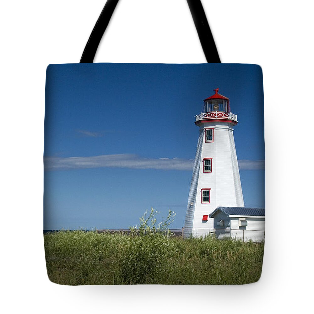 Art Tote Bag featuring the photograph Lighthouse at North Cape on PEI by Randall Nyhof