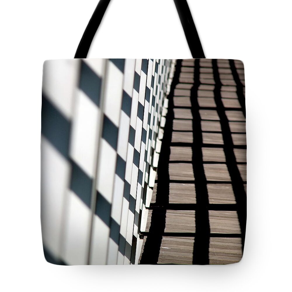 Lines Tote Bag featuring the photograph Lines and Shadows by Jeff Lowe