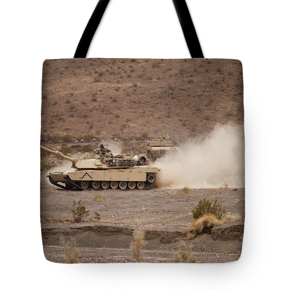 Military Tote Bag featuring the photograph Marines Roll Through The Combat Center by Stocktrek Images