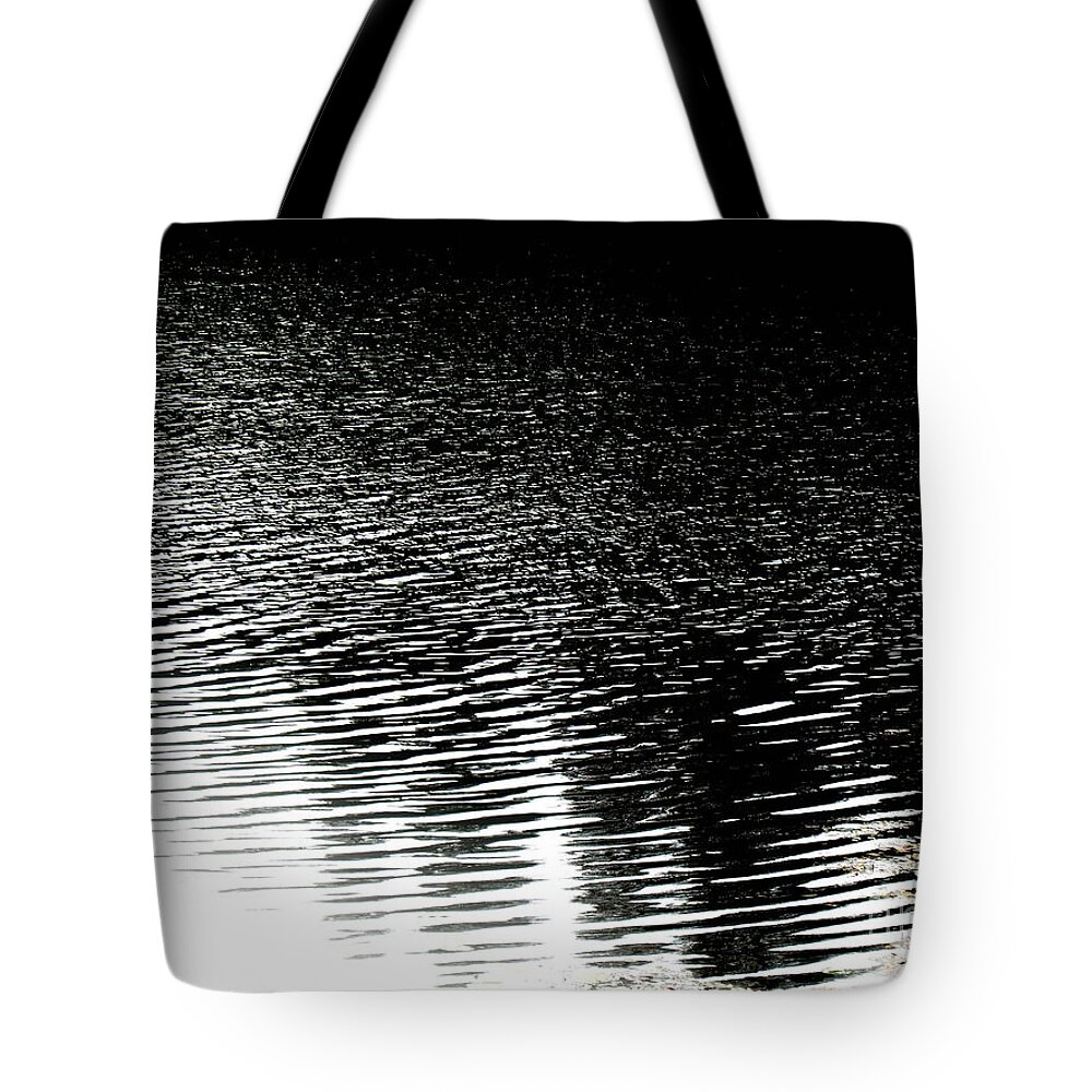 Black Canvas Prints Tote Bag featuring the photograph Moonlight sparkle by Pauli Hyvonen