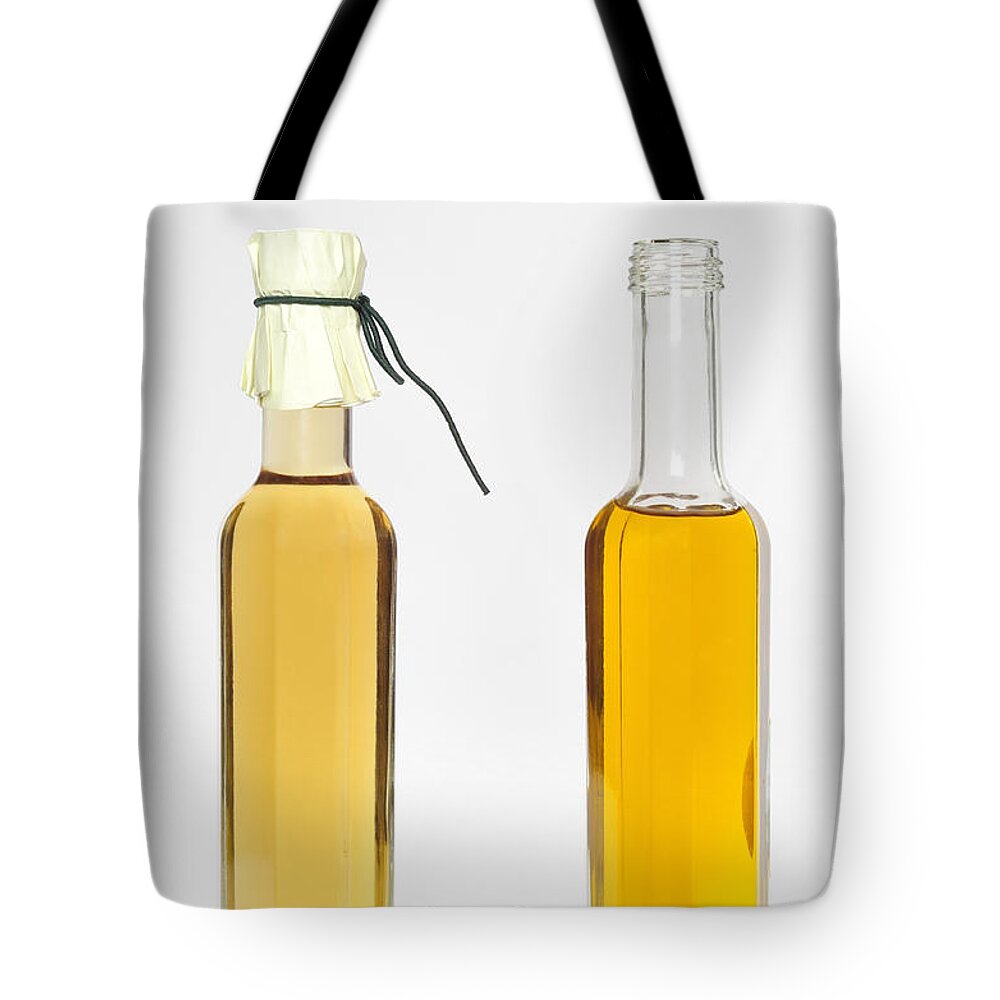 Balsamic Vinegar Tote Bag featuring the photograph Oil and vinegar bottles by Matthias Hauser