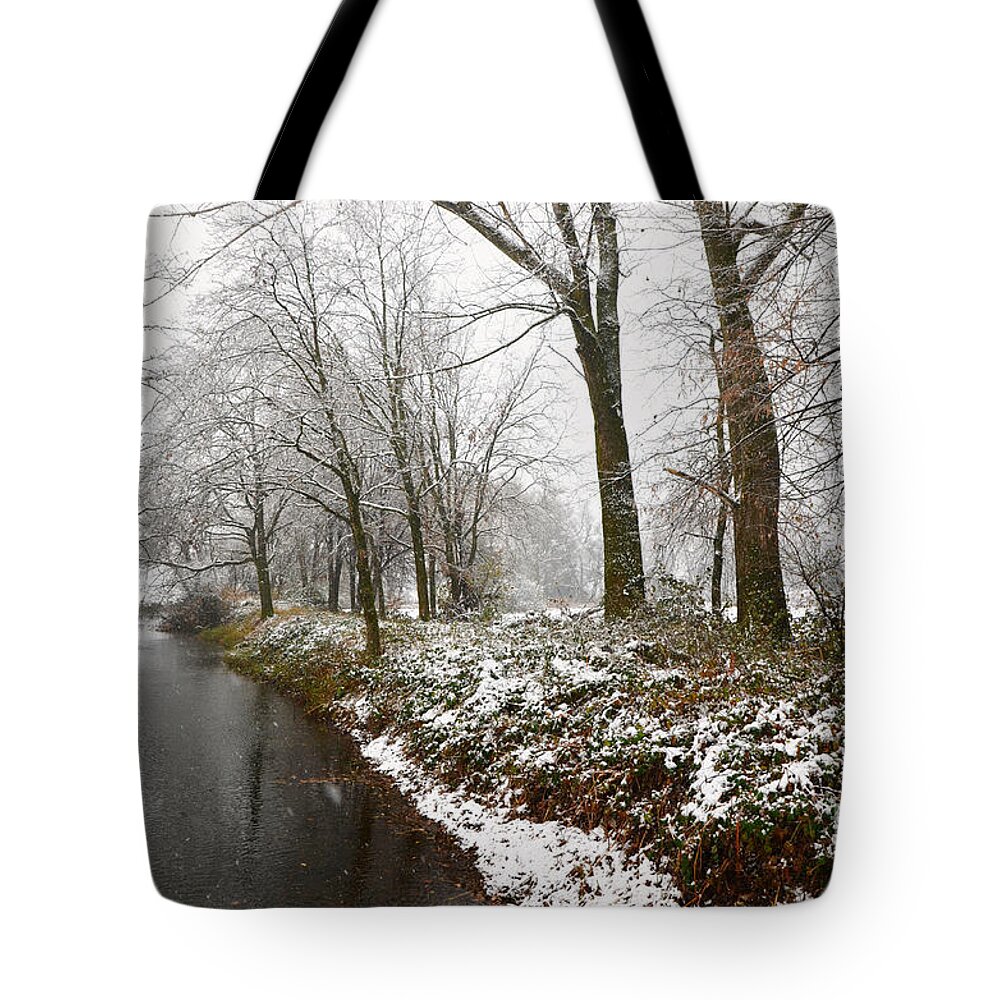 River Tote Bag featuring the photograph River with snow by Mats Silvan