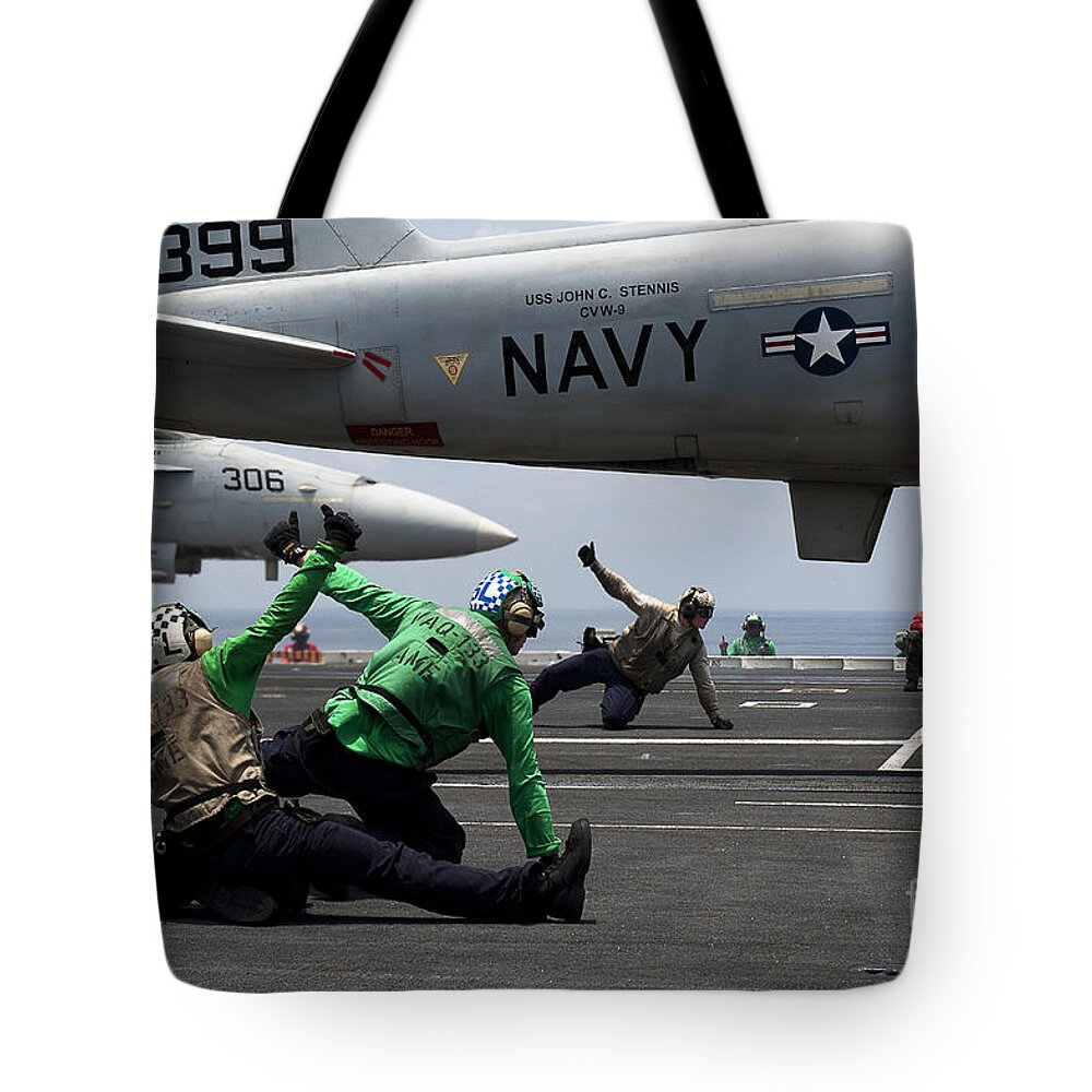 Uss John C Stennis Tote Bag featuring the photograph Sailors Give Launch Approval For An by Stocktrek Images