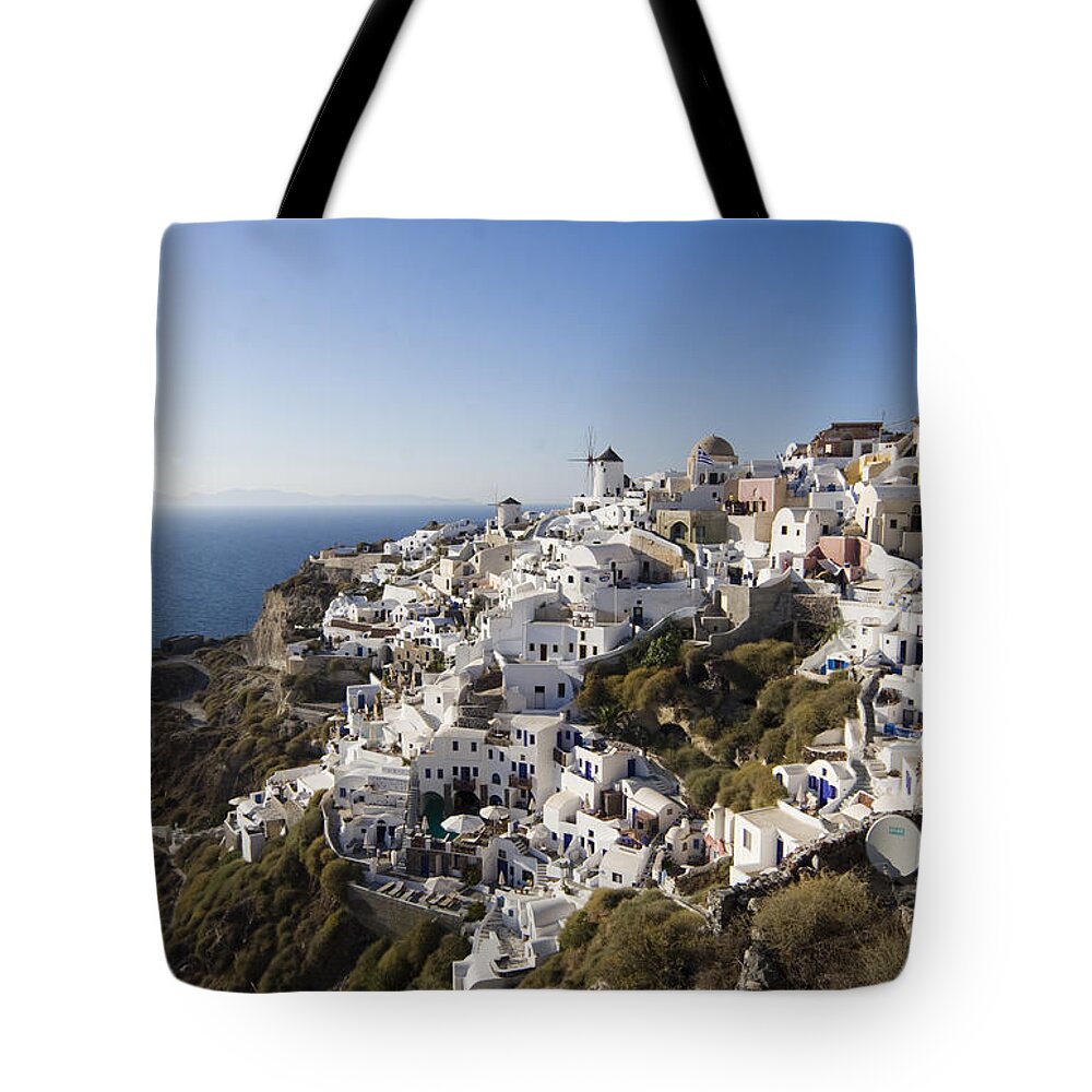 Santorini Tote Bag featuring the photograph Santorini Cliff by Leslie Leda