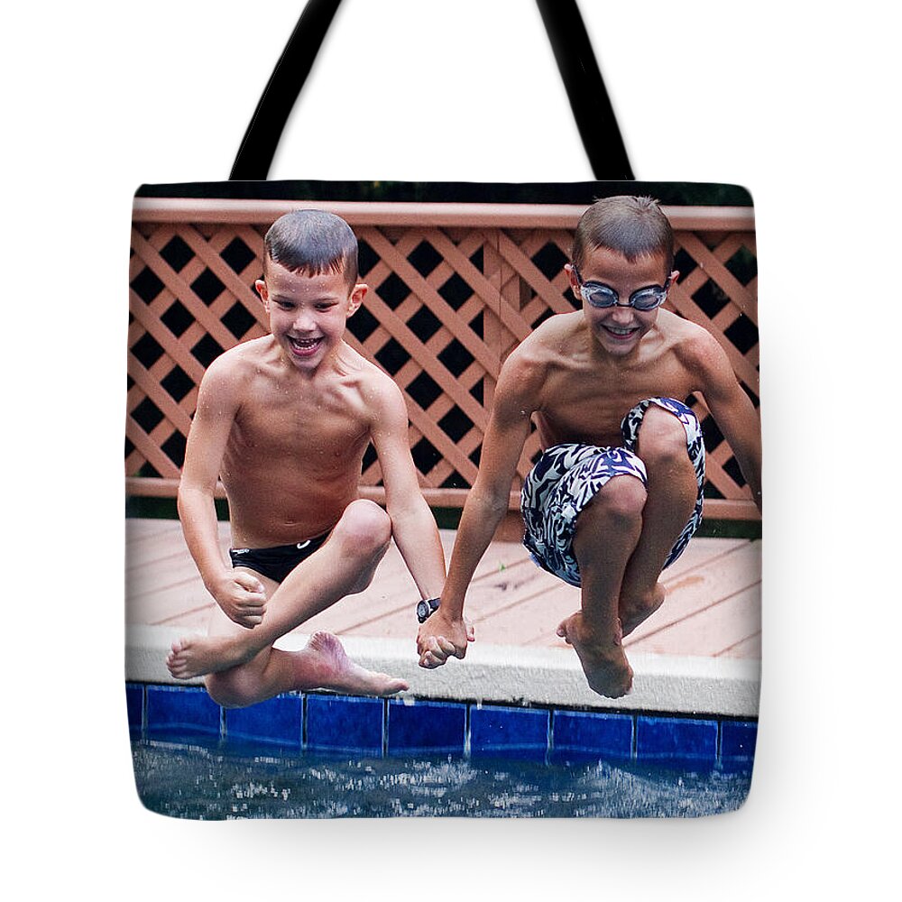 Synchronized Tote Bag featuring the photograph Synchronized Cannonballs by Farol Tomson