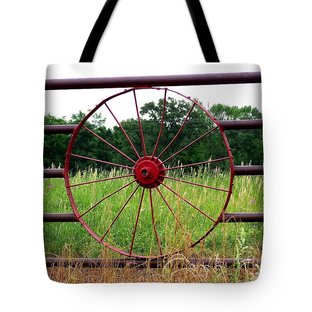 Wildflowers Tote Bag featuring the photograph Texas Wildflowers Through Wagon Wheel by Kathy White