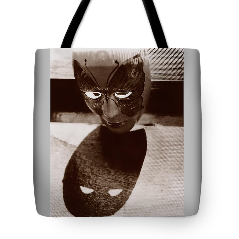 Mask Tote Bag featuring the photograph The Mask by Kevin Duke