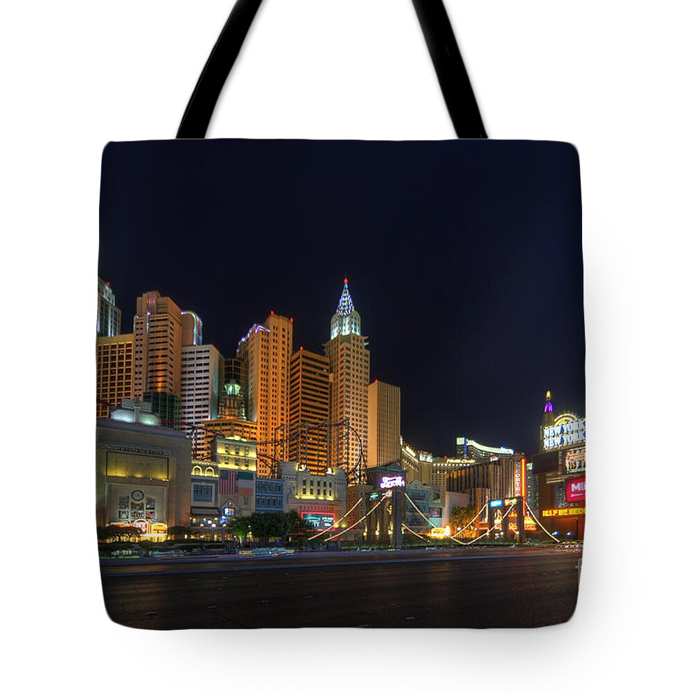 Art Tote Bag featuring the photograph The Strip by Yhun Suarez