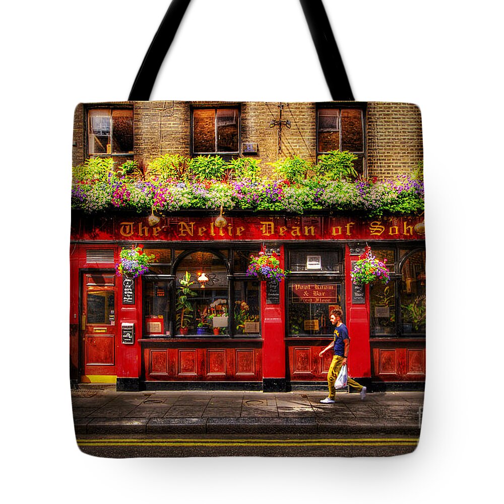 Building Tote Bag featuring the photograph Tuesday by Yhun Suarez