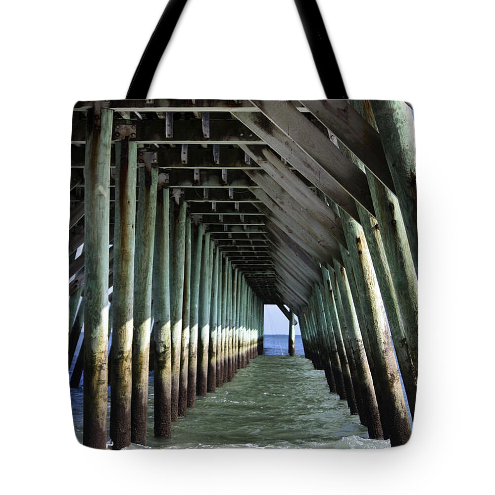 Sunlight Tote Bag featuring the photograph Under the Pier by Teresa Mucha