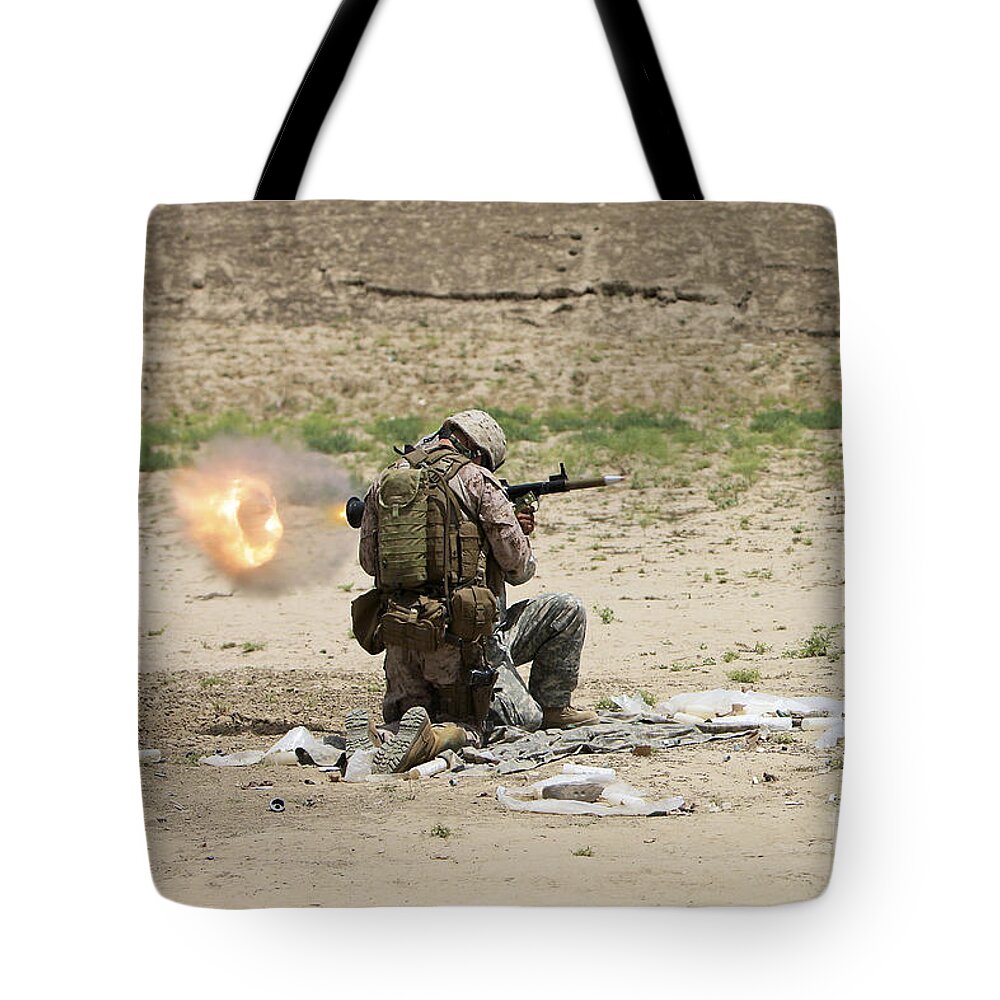 Afghanistan Tote Bag featuring the photograph U.s. Army Soldier Fires by Terry Moore