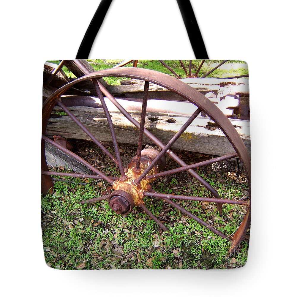 Artoffoxvox Tote Bag featuring the photograph Wheel In Time Photograph by Kristen Fox