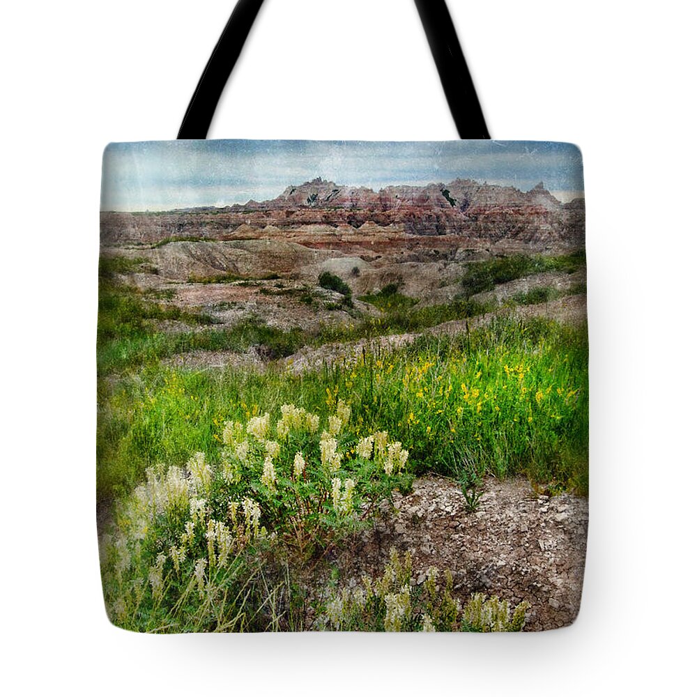 Badlands Tote Bag featuring the photograph Wildflowers in Badlands by Jill Battaglia