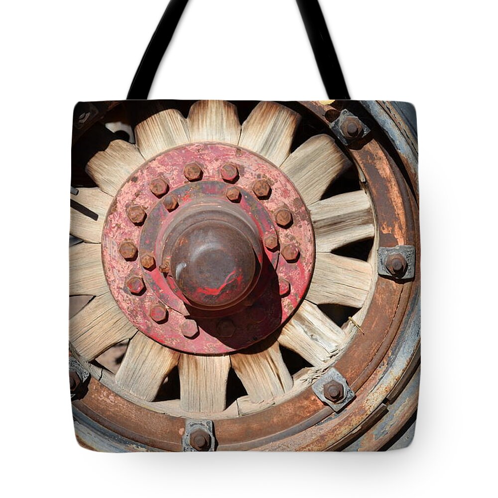 Wooden Spokes Tote Bag featuring the photograph Willful Wheel by Diane montana Jansson