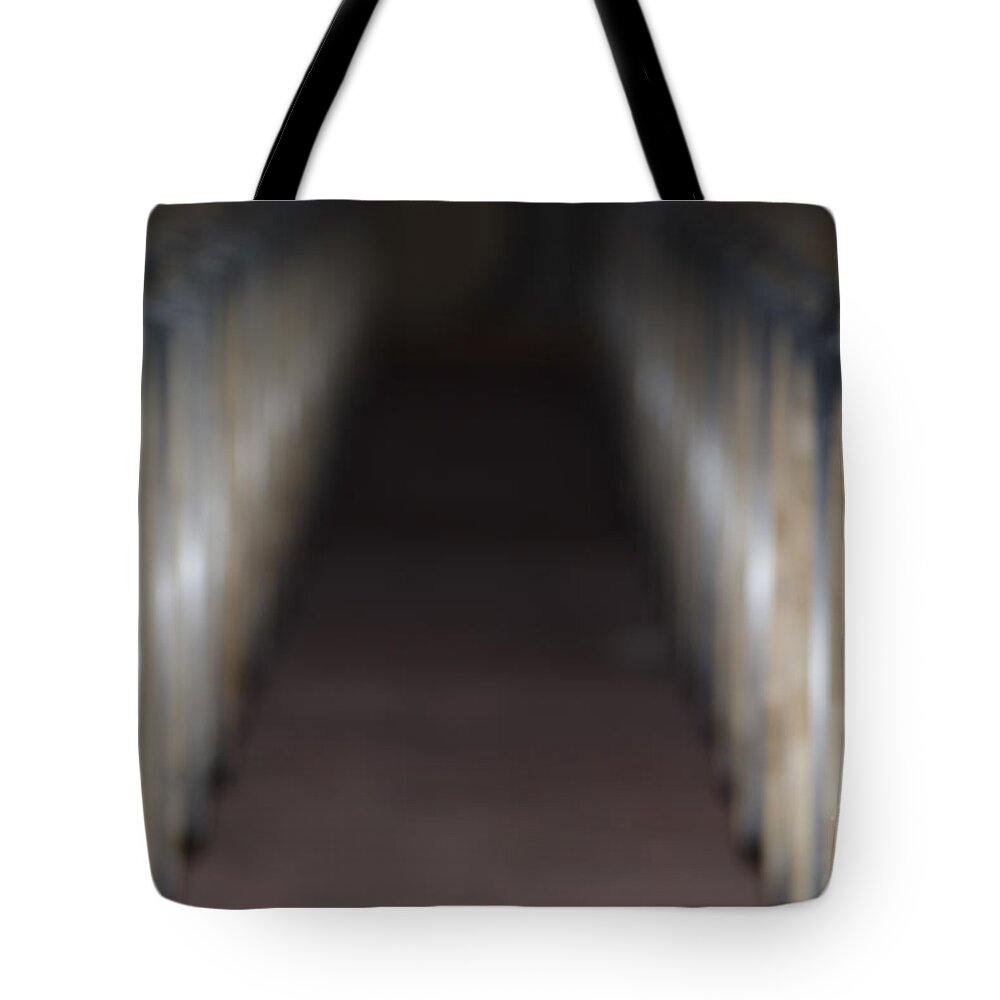 Wine Barrel Tote Bag featuring the photograph Wine barrels in line by Mats Silvan